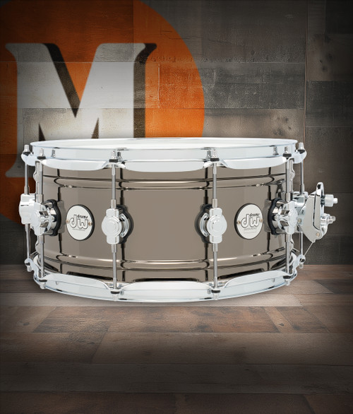 DW Design Series 14" x 6.5" Snare Drum â€“ Black Nickel Over Brass (DDSD6514BNCR) featuring a brass shell with black nickel plating for rich tone, warm resonance, and striking style.