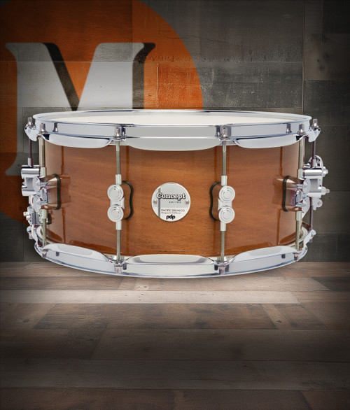 PDP Concept Maple Exotic 6.5x14 Snare Drum in Natural Honey Mahogany Lacquer finish with maple shell and chrome hardware, producing rich tone and striking exotic look.