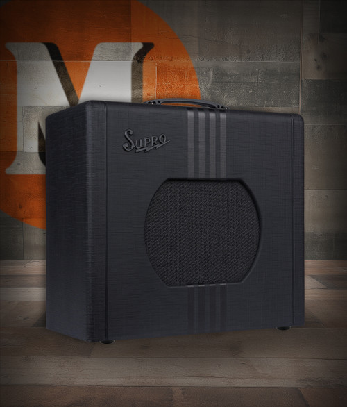 Supro Delta King 12 - 15-Watt 1x12 Combo Amp with Reverb (1822RBB) featuring Black & Black styling, tube-driven tone, built-in reverb, and a powerful 12-inch speaker for stage and studio use.