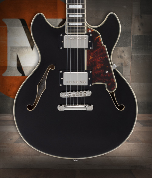 DÃ¢â‚¬â„¢Angelico Premier Mini DC - Black Flake (DAPMDCBLF2NS) featuring a compact semi-hollow double-cut design, stop-bar tailpiece, dual humbuckers, and a rich Dark Iced Tea Burst finish for warm, versatile tone.