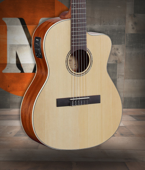 The Alvarez Regent RC26HCE Hybrid Classical Acoustic-Electric (RC26HCE) blends nylon-string warmth with modern steel-string playability. It features a spruce top, mahogany back and sides, a comfortable 46mm nut width, and a radiused fingerboard for easier chording and smoother transitions. The cutaway provides upper-fret access, while onboard electronics deliver clear amplified tone. Includes a deluxe padded gig bag, making it ideal for beginners, crossover players, and performers.