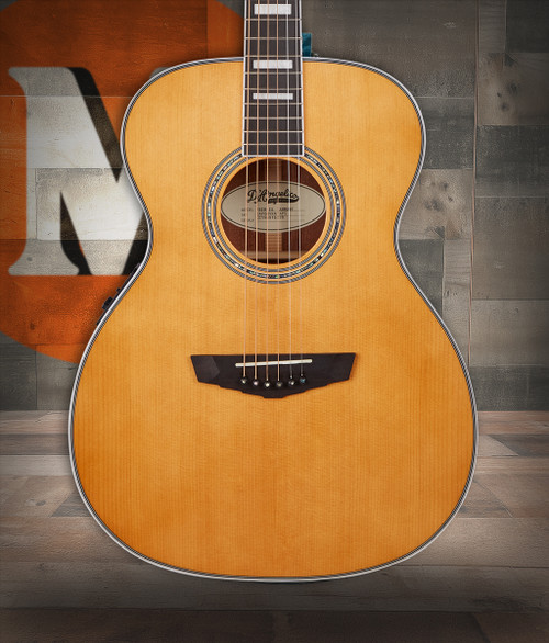 The Tammany Orchestra E Acoustic Guitar (DAPOMVNATAPS) features an Orchestra-size body with a smooth Vintage Natural finish for classic acoustic appeal. Designed for comfort and balanced tone, it offers warm mids, clear highs, and easy playabilityâ€”perfect for students, casual players, and those wanting a comfortable, great-sounding acoustic for practice or performance.