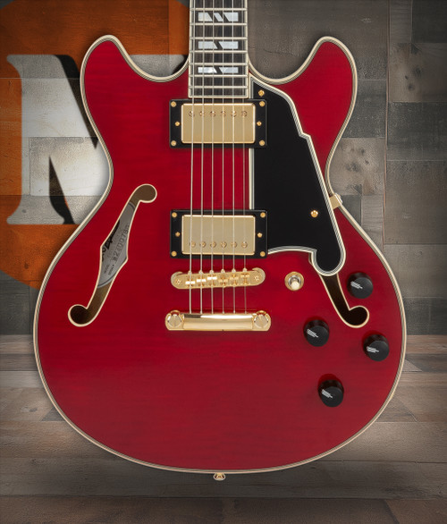 Dâ€™Angelico Mini Double Cutaway electric guitar in Trans Cherry featuring a compact double-cut body, stop-bar tailpiece, humbucker pickups, chrome hardware, and classic Dâ€™Angelico tone and styling.