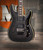 Schecter Omen Extreme FR Electric Guitar - See-Thru Black finish with quilted maple top, Floyd Rose tremolo, and dual humbuckers delivering aggressive tone and smooth playability