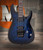 Schecter Omen Elite-6 FR Electric Guitar - Ocean Blue Burst featuring quilted maple top, Floyd Rose tremolo, Schecter Diamond pickups, and sleek black hardware for modern tone and style