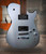 Cort Manson Silver Rainbow Electric Guitar – metallic silver finish with Sustainiac neck pickup and Seymour Duncan Black Winter bridge pickup, front angled view