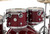 DW Design Series 4-Piece Maple Shell Pack in Cherry Stain finish with chrome hardware featuring maple shells, professional tone, and classic DW craftsmanship – available at Musician Madness.