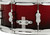 PDP Concept Maple 5.5x14 Snare Drum in Red to Black Fade Lacquer finish with maple shell and chrome hardware, blending modern style with warm tone.