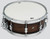PDP Concept Maple Exotic 5.5x14 Snare Drum in Walnut to Charcoal Burst Lacquer finish with maple shell and chrome hardware, offering rich tone and elegant burst style.