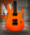 The Schecter USA Sunset Extreme Neon electric guitar in Neon Orange (7221) delivers premium USA-made craftsmanship, aggressive tone, and striking looks for modern rock and metal players. Available at Musician Madness.