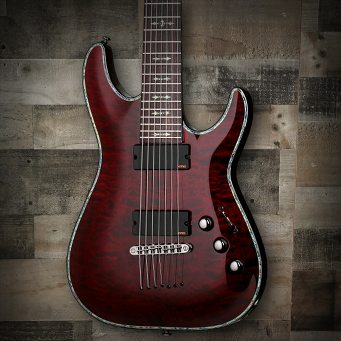 Schecter Hellraiser C-7 Electric Guitar with quilted maple top, EMG active pickups, and seven-string design in gloss finish.