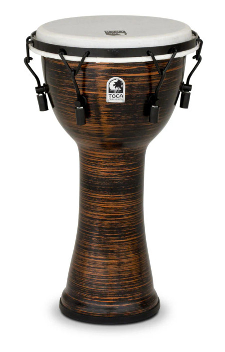 The Toca Freestyle II Mechanical Tune Djembe (TF2DM-10SC) features a 10" synthetic shell with a durable spun copper finish. Equipped with mechanical tuning hardware for fast, precise adjustments, this djembe delivers deep bass tones, sharp slaps, and consistent projection. Lightweight and weather-resistant, it’s ideal for drum circles, education, outdoor use, and traveling musicians.
