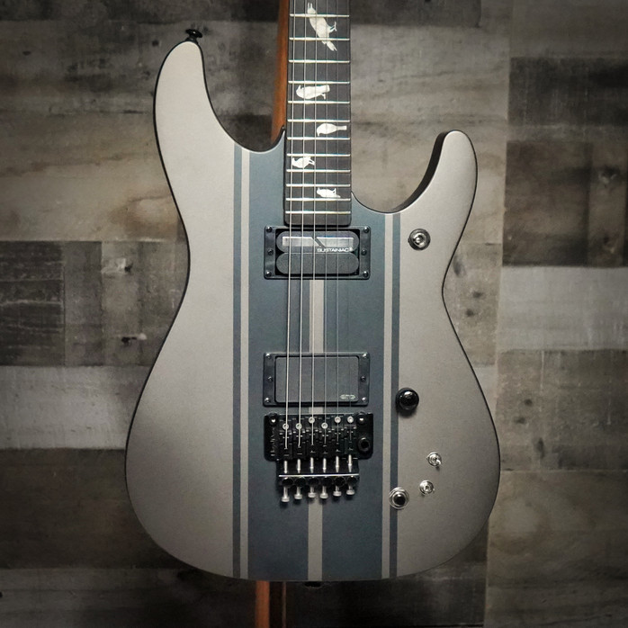 Schecter DJ Ashba Signature Electric Guitar – Carbon Grey finish featuring active pickups, custom body design, fast neck, and stage-ready tone built for modern hard rock and metal