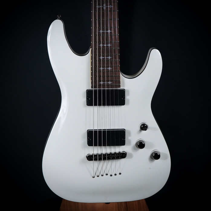Schecter Demon-7 Electric Guitar – Vintage White (B-Stock) 7-string guitar with Schecter Diamond Active pickups, arched top body, black hardware, and smooth extended-range tone