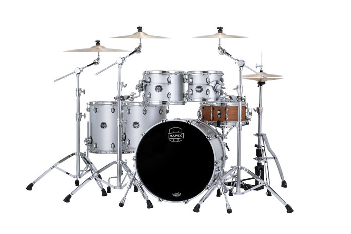 The Mapex Saturn Evolution SE628XMPD Workhorse 5-Piece Shell Pack features hybrid maple/walnut shells engineered for exceptional projection, dynamic clarity, and tonal richness. Finished in Iridium Silver, this kit blends durability with modern aesthetics. Enhanced with Saturn’s SAS Attack and Resonance systems and SONIClear bearing edges, it delivers consistent tuning, powerful attack, and studio-grade response—ideal for professional drummers.