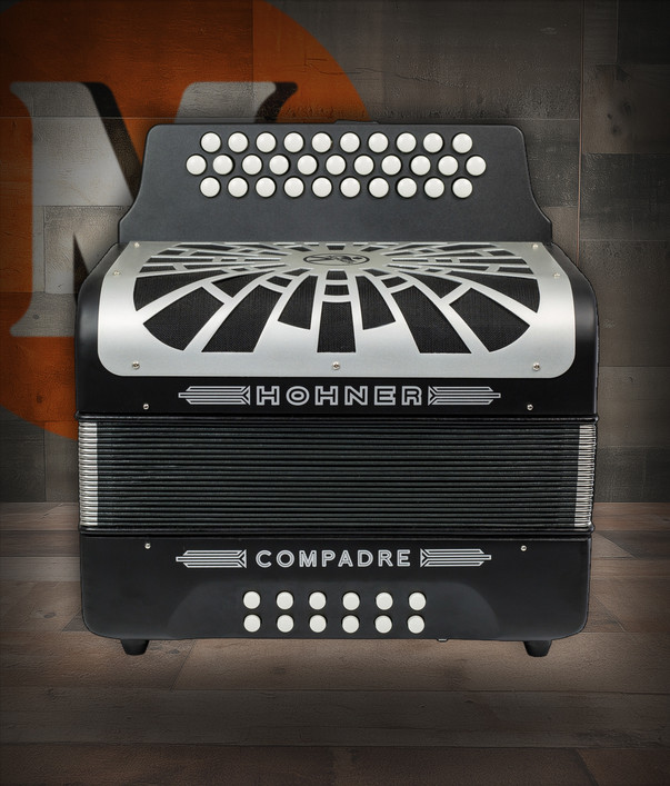 Hohner COFB-N Compadre FBbEb Accordion in Black with silver grille, diatonic button layout, and included gig bag.
