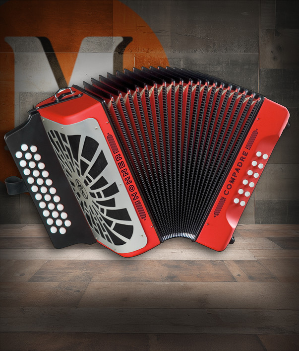 Hohner COER-N Compadre EAD Accordion in Red with silver grille, diatonic button layout, and included gig bag.