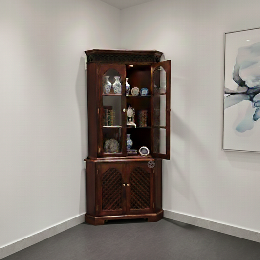 Corner cabinet with angled shape and closed storage.