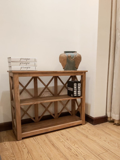 Acacia wood short bookcase with open shelves and compact design.