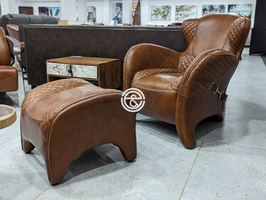Corlandus Armchair + Stool in Vegetable Brown Leather  Corlandus Armchair + Stool in Vegetable Brown Leather