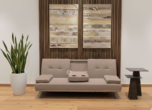 Beige Canberra fabric sofa bed featuring foldable sleeping function and center drop-down console table.