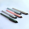 Set of five Uni-ball Air Micro pastel barrel pens in assorted colours arranged on white surface Set of five Uni-ball Air Micro pastel barrel pens in assorted colours arranged on white surface