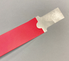 Red wristband with clear adhesive tab for printing