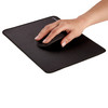 Hand using a mouse on the black Fellowes Breyta Desk Mat, demonstrating a spacious ergonomic mousing area.