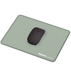 Fellowes Breyta Desk Mat in sage green with a black wireless mouse placed on top.