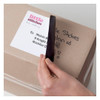Avery TrueBlock address label covering old shipping details on a reused cardboard box