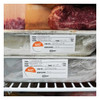 Avery food rotation labels applied to wrapped lasagne trays in a commercial freezer for prep, use by and employee tracking.