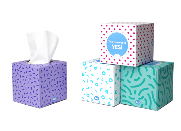 Assorted colourful Who Gives A Crap tissue boxes with visible tissues – eco-friendly, plastic-free packaging Assorted colourful Who Gives A Crap tissue boxes with visible tissues – eco-friendly, plastic-free packaging