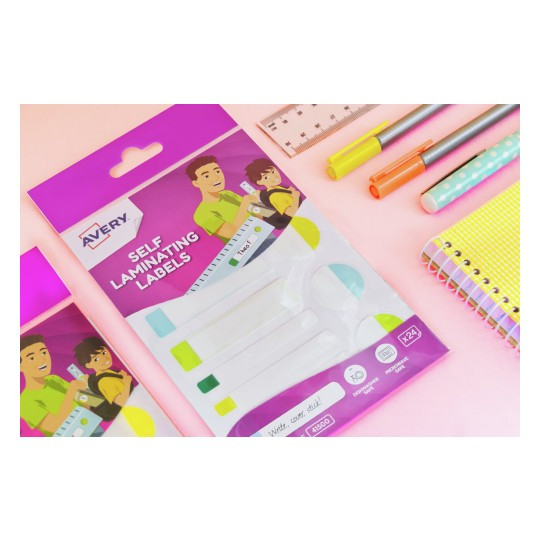 Avery 41500 self laminating labels pack on pink desk with pens ruler and notebook in background