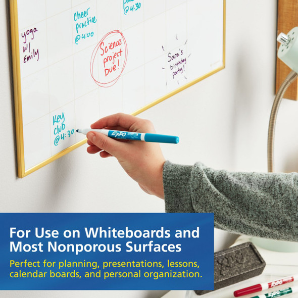 Person writing on a whiteboard using an EXPO low odour fine tip black dry erase marker