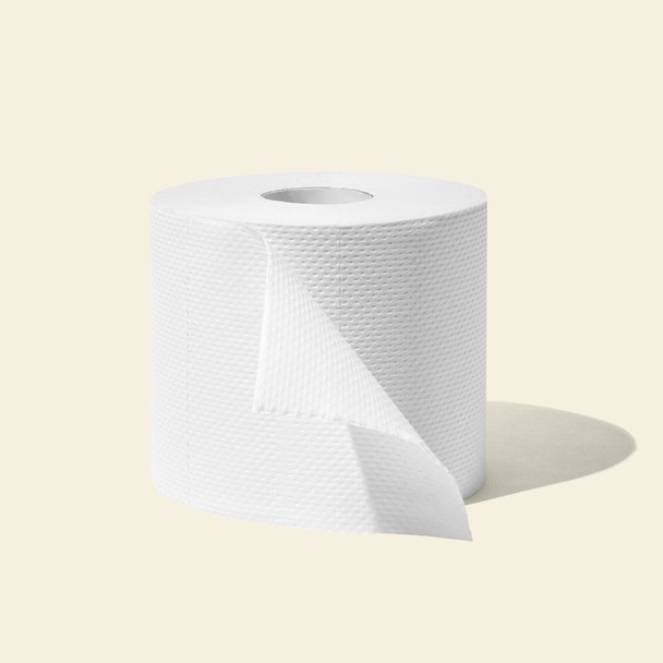 Single unwrapped roll of Who Gives A Crap recycled toilet paper on a neutral beige background
