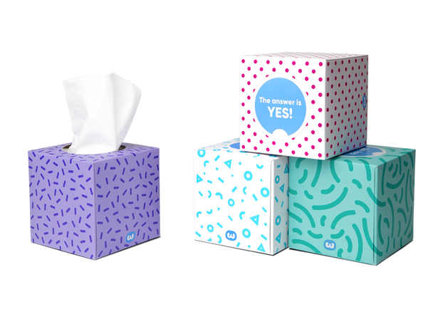 Assorted colourful Who Gives A Crap tissue boxes with visible tissues – eco-friendly, plastic-free packaging