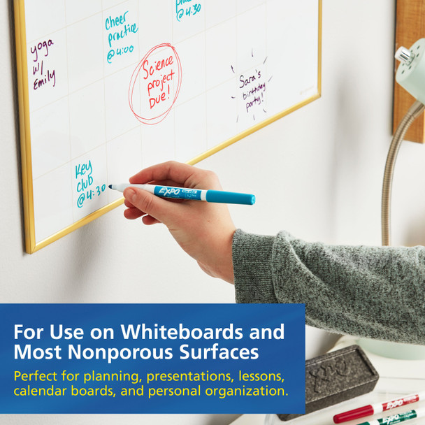 Person using Expo Low Odor Marker on whiteboard in classroom or office