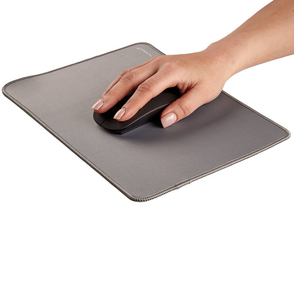 Hand using a mouse on the grey Fellowes Breyta Desk Mat, demonstrating a comfortable ergonomic work area.