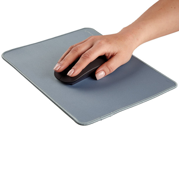 Hand using a mouse on the marine blue Fellowes Breyta Desk Mat, demonstrating a spacious ergonomic work area.
