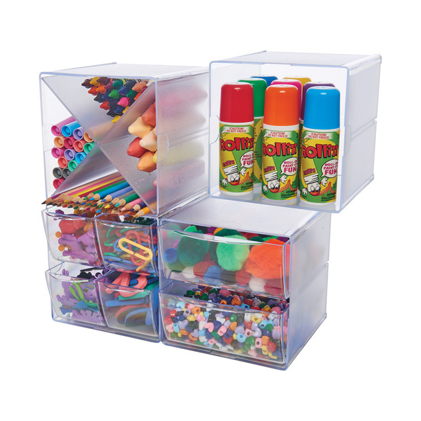 Set of four connected clear cube organisers filled with office and craft supplies, showing the modular stackable storage system in use.