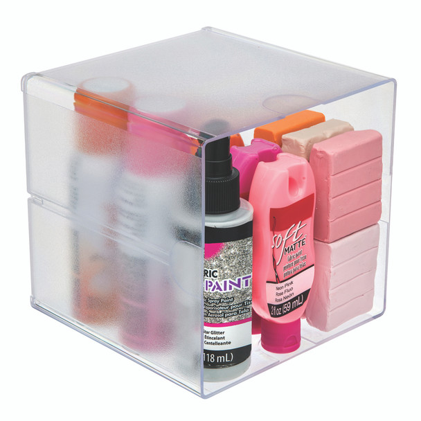 Clear open cube organiser storing assorted bottles and packets, demonstrating visible storage for personal or workspace essentials.