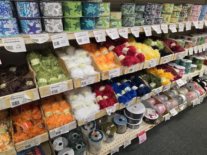 Aisle of colorful ribbons and craft supplies at Flora-Dec Sales in Honolulu