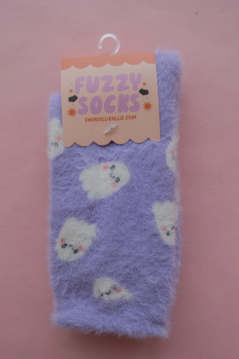 Pair of purple fuzzy socks with white ghost pattern, front view.