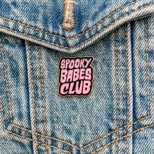 Spooky Babes Club pin styled on denim jacket. Spooky Babes Club pin styled on denim jacket.
