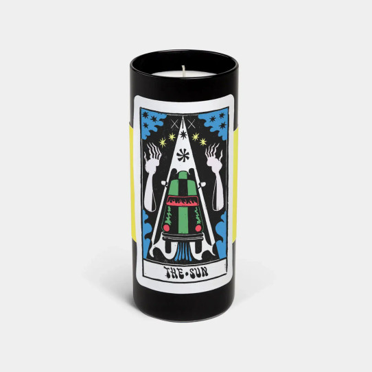 Black glass tarot candle featuring The Sun card illustration with colorful, bold graphic design.