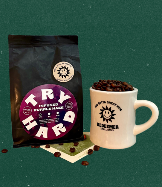 Flat lay of Try Hard coffee bag and Redeemer ceramic mug filled with coffee beans on a green background.