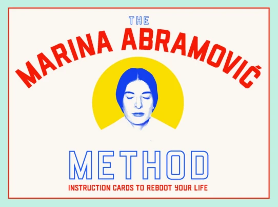 The Marina Abramović Method instruction card set featuring a blue portrait of the artist with closed eyes against a yellow circle, bold red lettering, and a mint green background.