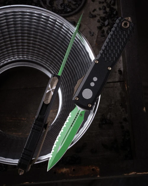 Microtech UTX-85 GEN IV OTF Auto D/E Serrated Jedi Master W/Green Blade Bronze Hardware Black Chassis AUMT123243JM