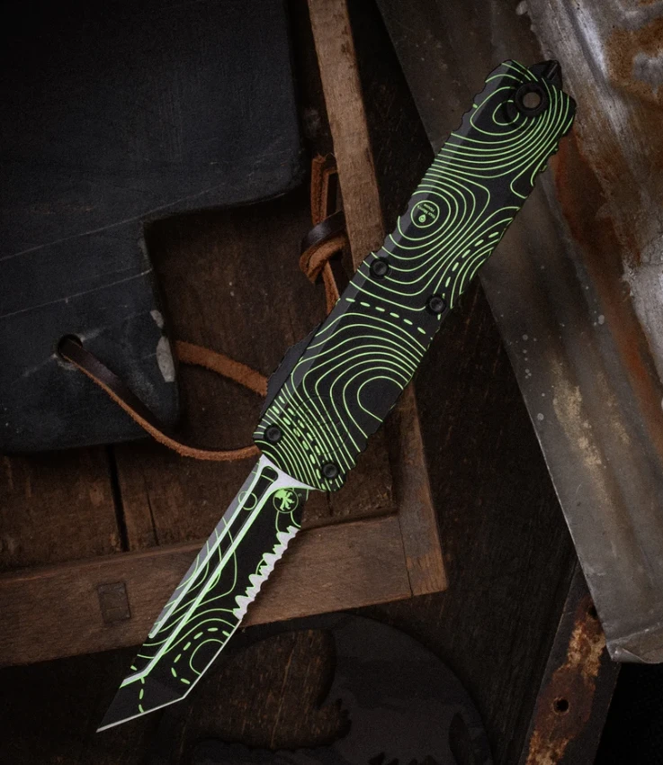 Microtech UTX-85 Gen IV Signature Series OTF Automatic Partially Serrated Topographic Black and Parakeet Green Camo S/E AUMT123142TPBKPGCS View 1