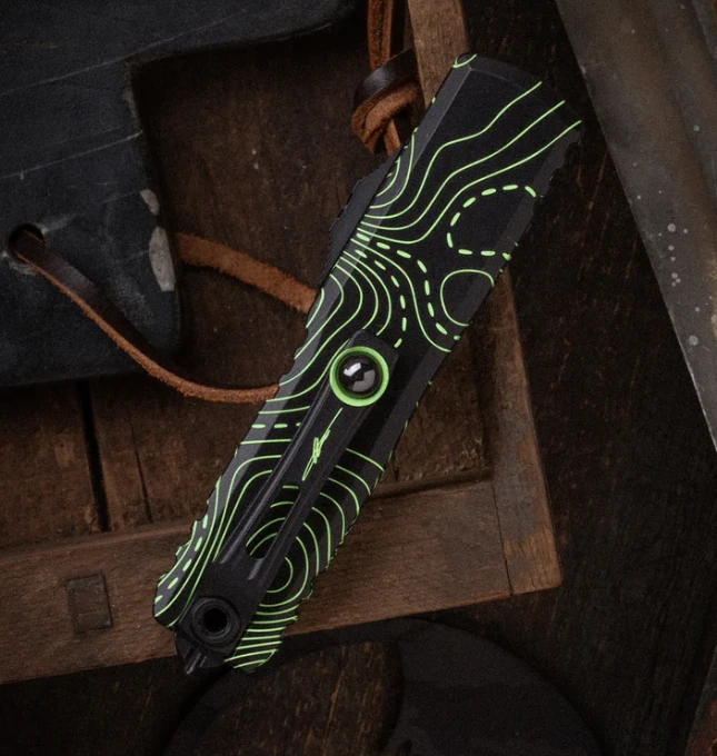 Microtech UTX-85 Gen IV Signature Series OTF Automatic Partially Serrated Topographic Black and Parakeet Green Camo S/E AUMT123142TPBKPGCS View 2